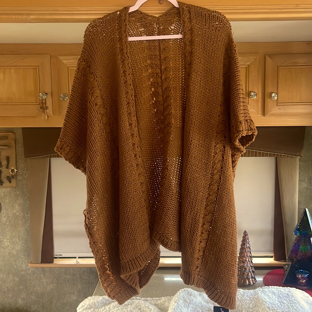 Caramel knit sweater Cape with sleeves.